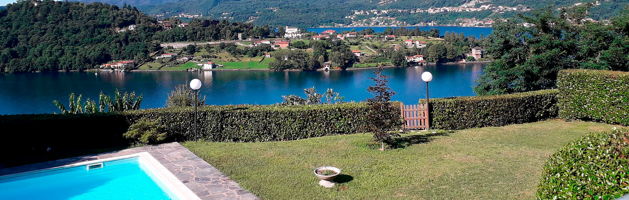 MIASINO Appartamento vista lago con giardino e piscina condominiale